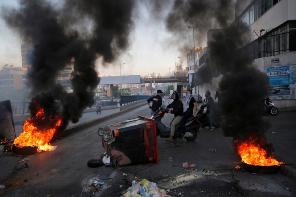 Lebanese protesters block roads, burns tires over economic hardships