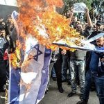 Demonstrators burn Israeli flag ahead of Israeli president’s visit to Turkey